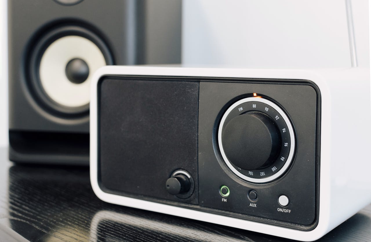 Close-up of a modern radio and speaker setup, showcasing audio equipment design.